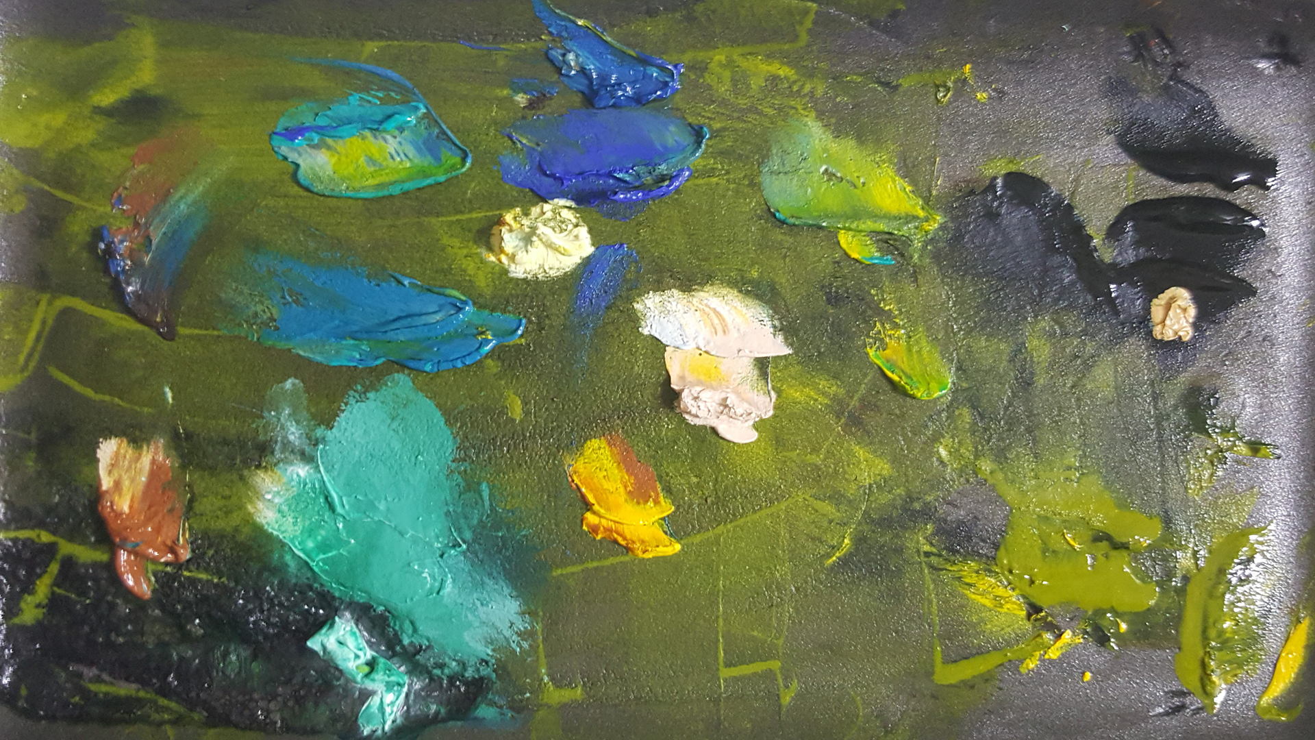 Portada. Paleta llena de pintura